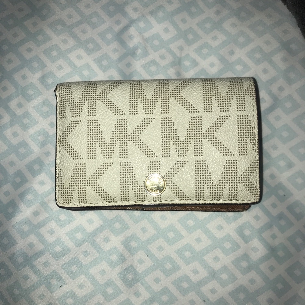 Cream and brown Michael Kors wallet.